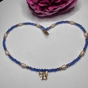 Elegant Blue Beaded Necklace with Gold Butterfly Pendant